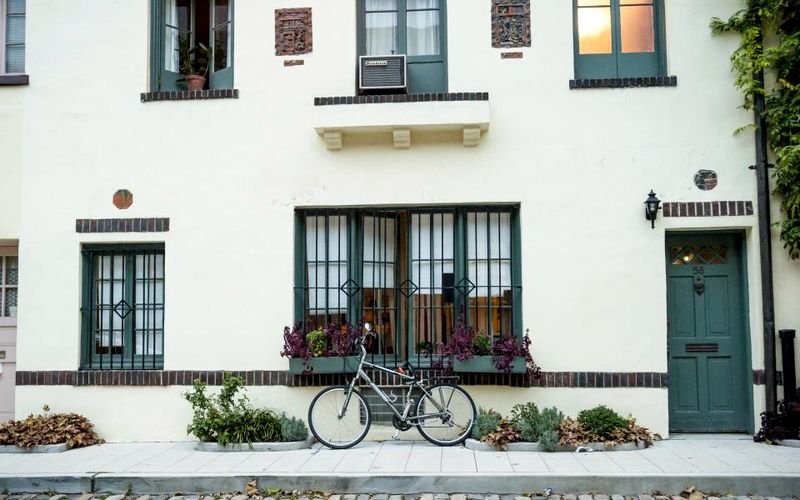 Rendered residential facade with neatly finished window reveals
